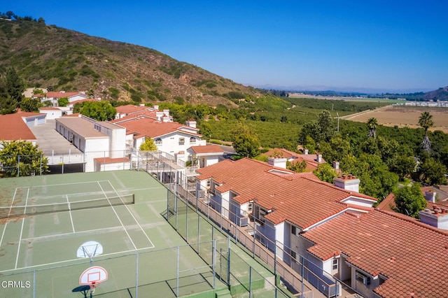 birds eye view of property with a mountain view