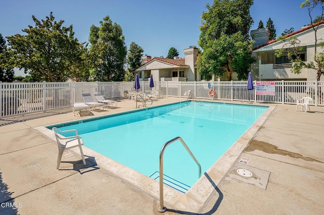 view of pool featuring a patio