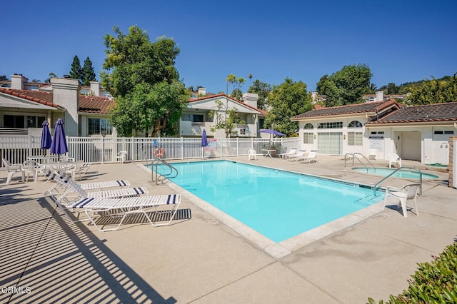 view of swimming pool with a patio area