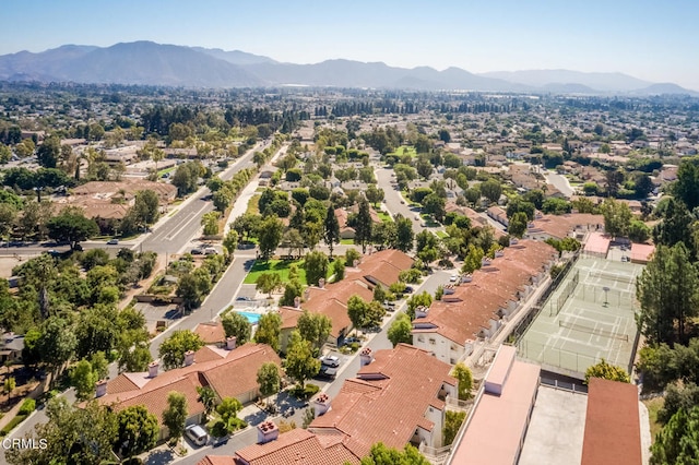 birds eye view of property featuring a mountain view