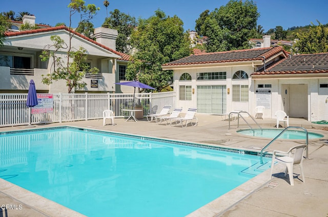 view of swimming pool with a patio area