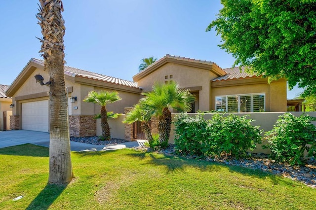 view of front of house with a garage and a front lawn