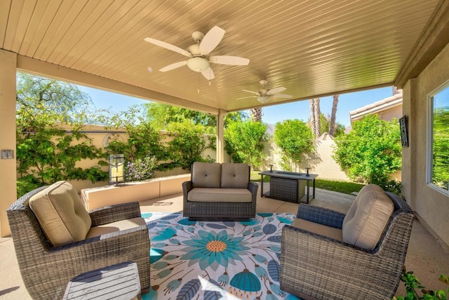 view of patio / terrace with an outdoor living space and ceiling fan