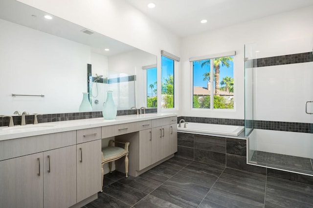 bathroom featuring vanity and separate shower and tub