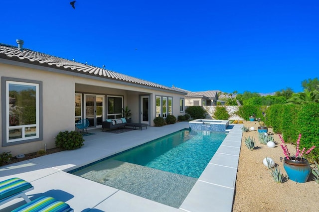 view of swimming pool featuring an in ground hot tub and a patio area