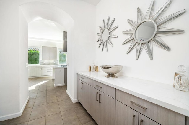 bathroom featuring tile patterned flooring and vanity