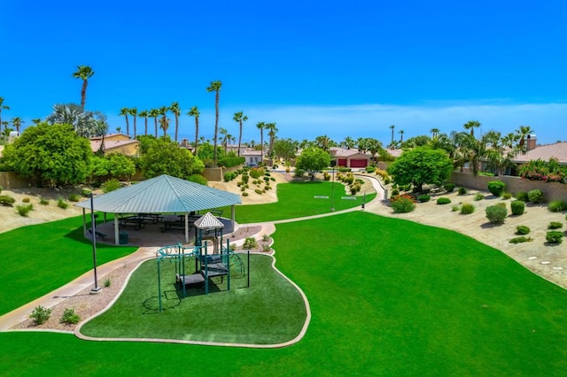 surrounding community with a lawn, a playground, and a gazebo