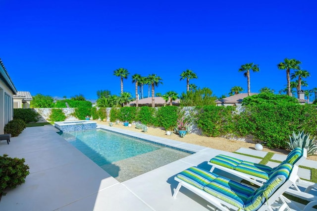 view of swimming pool featuring a patio area