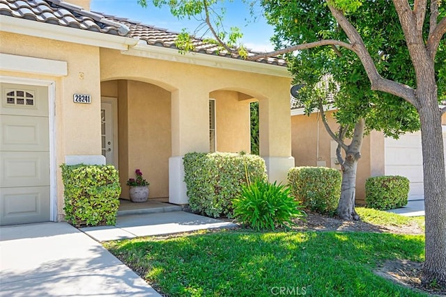 property entrance with a garage