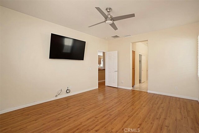 unfurnished bedroom featuring ceiling fan and light wood-type flooring