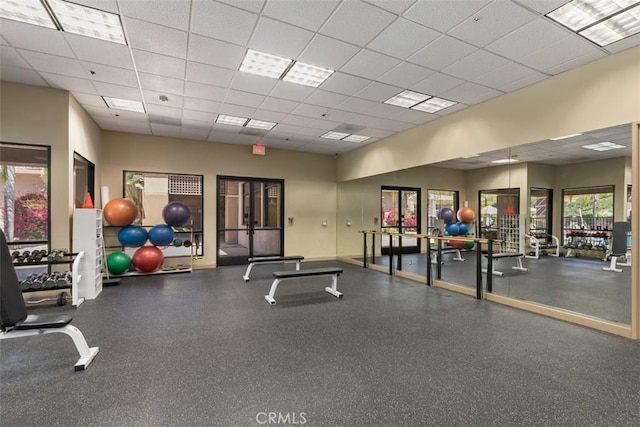 workout area featuring a paneled ceiling