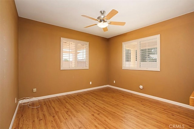 unfurnished room featuring ceiling fan and hardwood / wood-style flooring