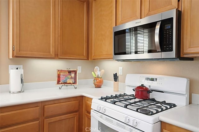 kitchen with white gas range