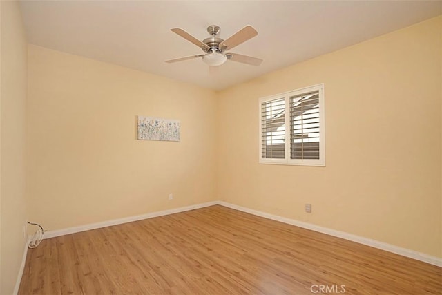 empty room with light hardwood / wood-style flooring and ceiling fan