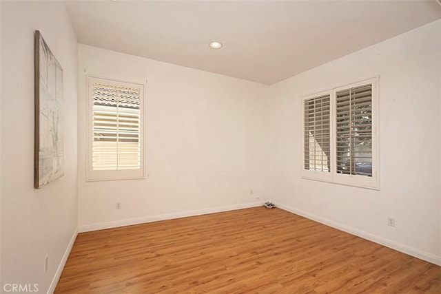 unfurnished room featuring light wood-type flooring