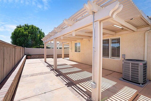 view of patio with a pergola and central AC