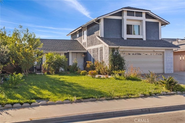 view of front facade featuring a front yard and a garage