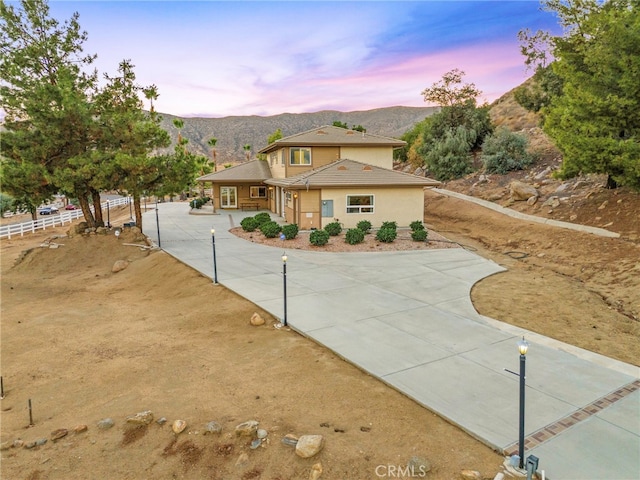 view of front of property with a mountain view