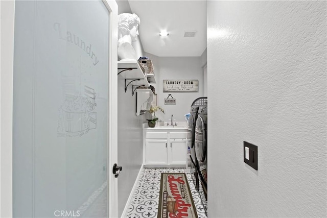 laundry area with washing machine and dryer