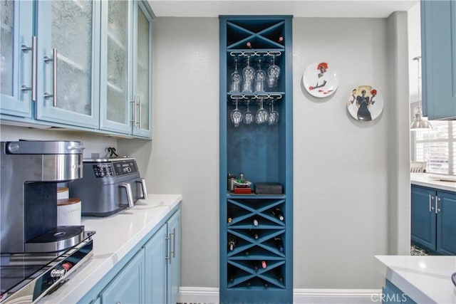 bar with blue cabinetry