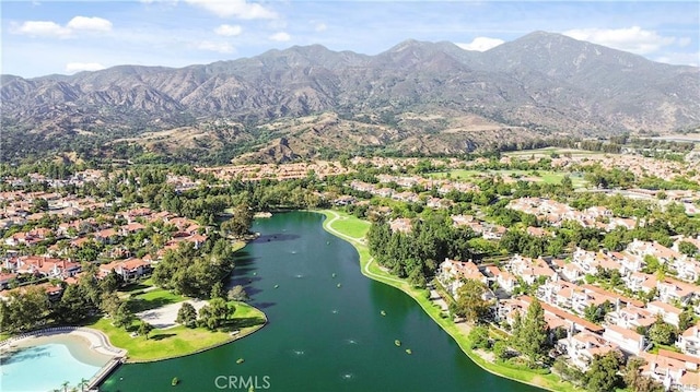 aerial view featuring a water and mountain view