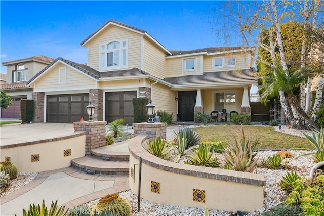 view of front of property with a garage and a front lawn