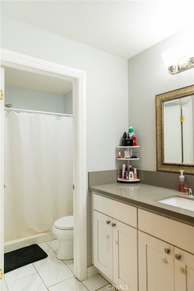 bathroom with tile patterned flooring, vanity, toilet, and a shower with curtain