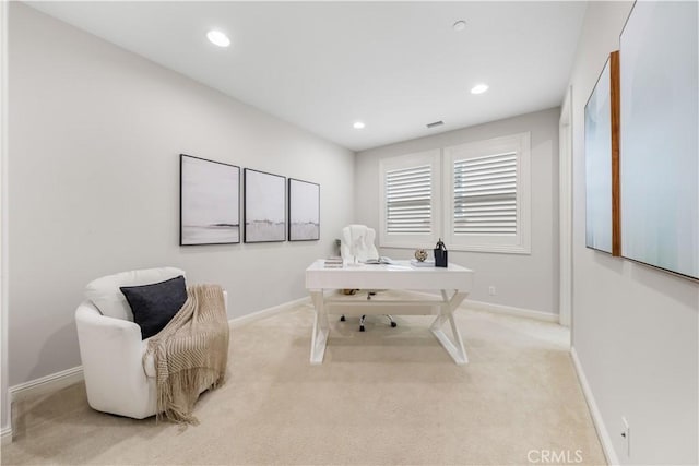 office space with light colored carpet