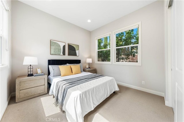 bedroom with light colored carpet