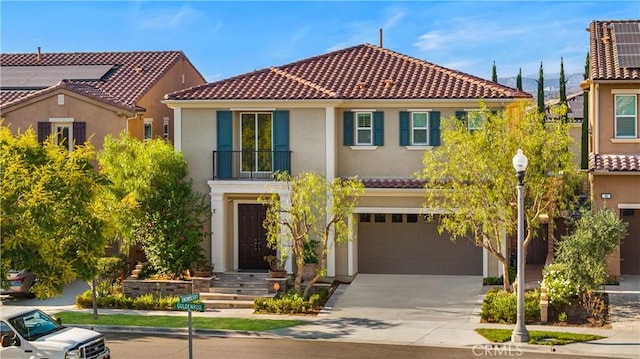 mediterranean / spanish house with a garage