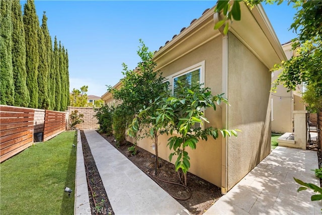 view of property exterior featuring a yard