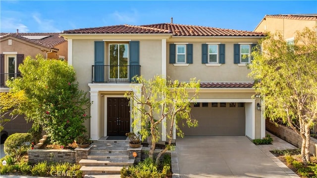 mediterranean / spanish-style home featuring a balcony and a garage