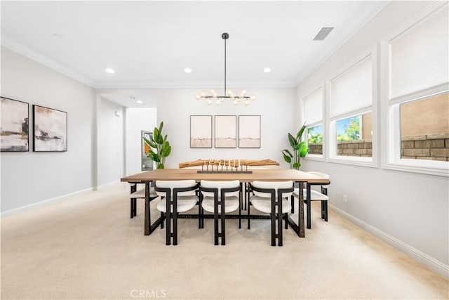 dining area featuring light carpet, crown molding, and an inviting chandelier