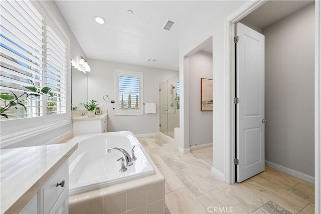 bathroom featuring separate shower and tub and vanity