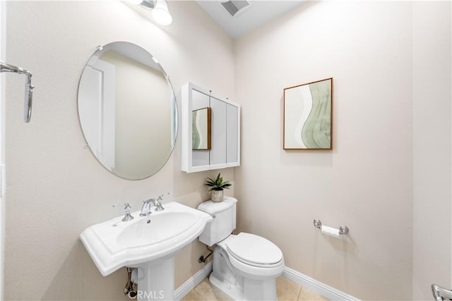 bathroom with tile patterned floors and toilet