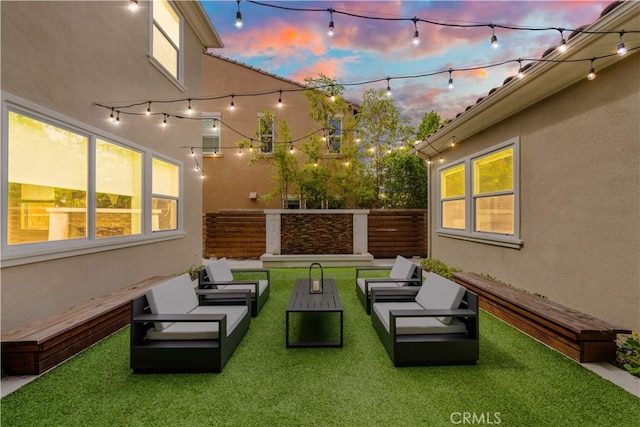 yard at dusk with outdoor lounge area