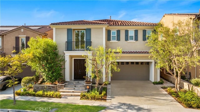 mediterranean / spanish home featuring a garage