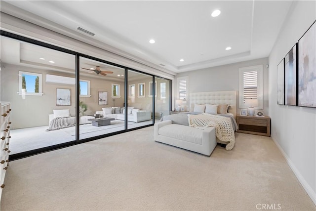 bedroom with light carpet, access to exterior, and multiple windows