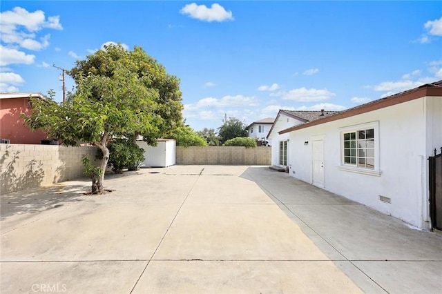 view of patio with a storage shed