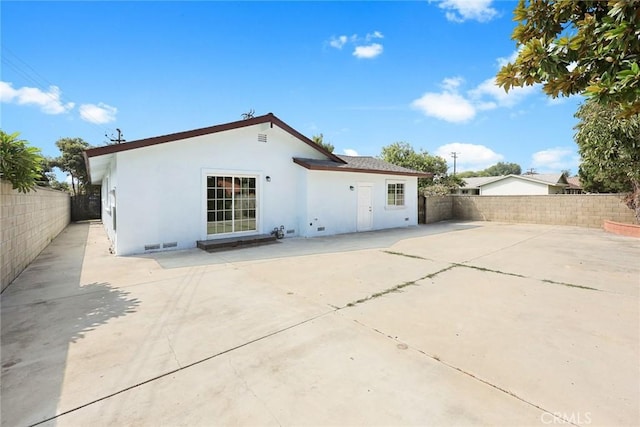 rear view of property featuring a patio area