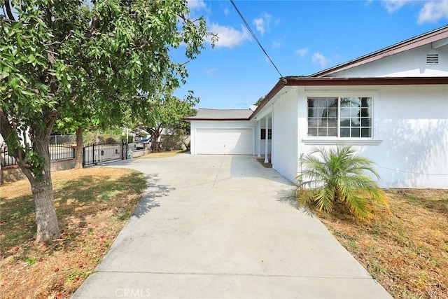 view of property exterior featuring a garage