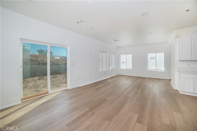 unfurnished living room featuring light hardwood / wood-style flooring