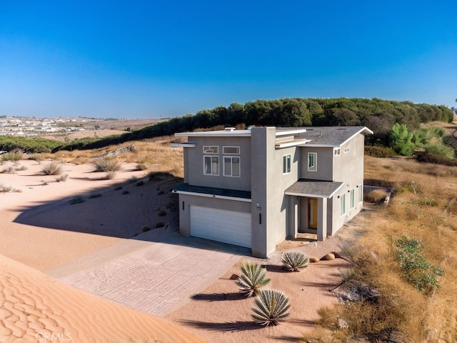 view of front of property with a garage