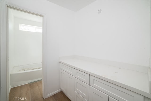 bathroom featuring hardwood / wood-style flooring