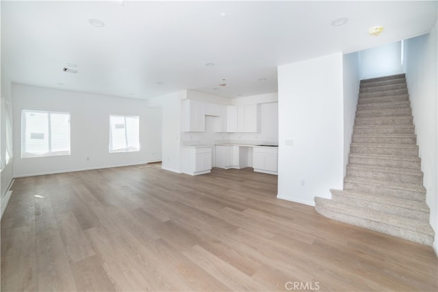 unfurnished living room with light hardwood / wood-style flooring