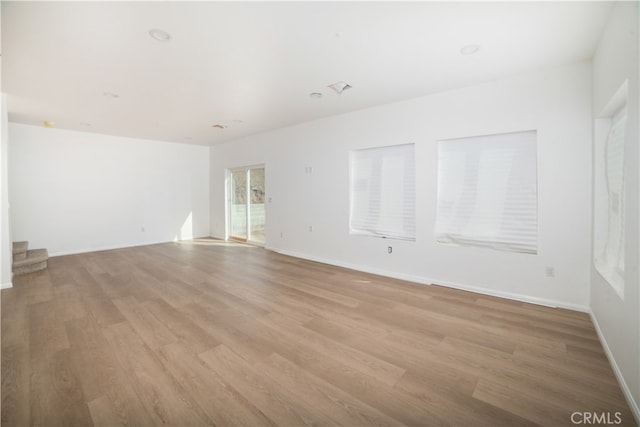 unfurnished room featuring light hardwood / wood-style floors