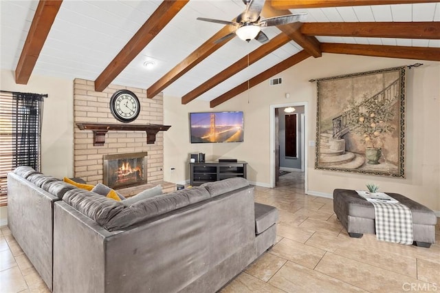 living room featuring a fireplace, light tile patterned floors, vaulted ceiling with beams, and ceiling fan