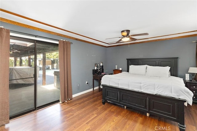 bedroom with dark hardwood / wood-style floors, ceiling fan, access to exterior, and ornamental molding