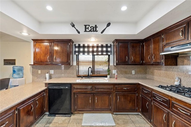 kitchen featuring dishwasher, decorative backsplash, dark brown cabinetry, and sink