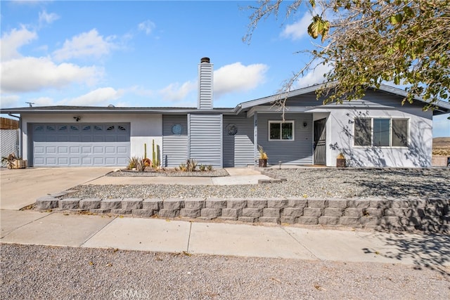 ranch-style home featuring a garage